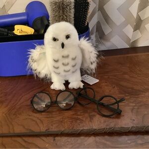Lot of HARRY POTTER items 2 round glasses, one wand, one furry white owl.